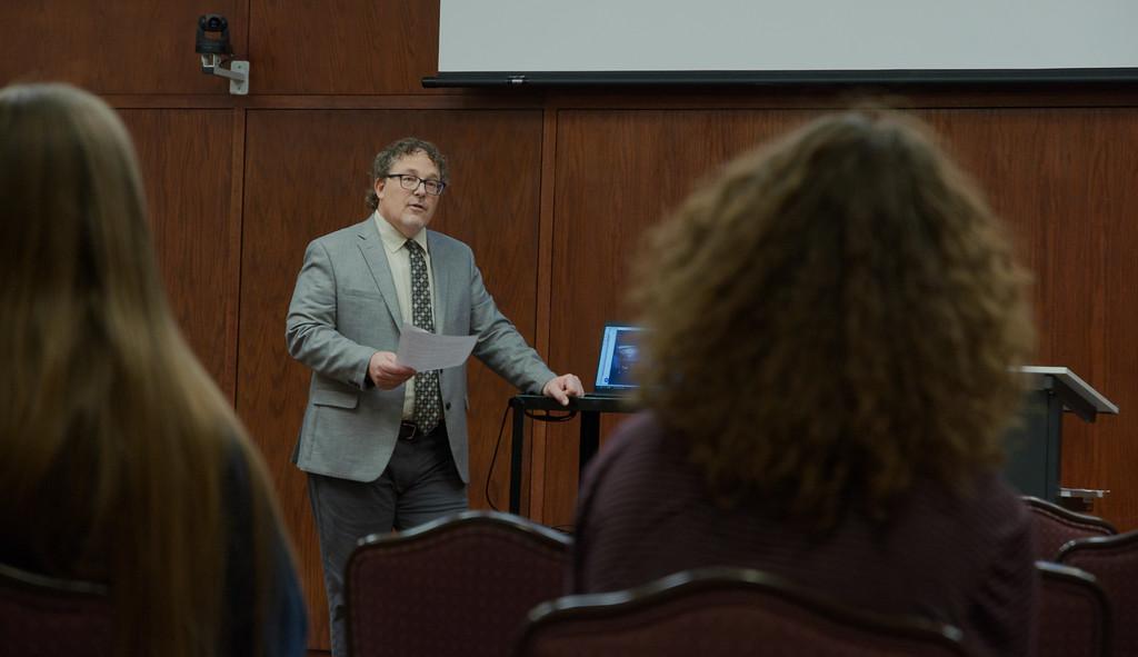 Professor lecturing to a group