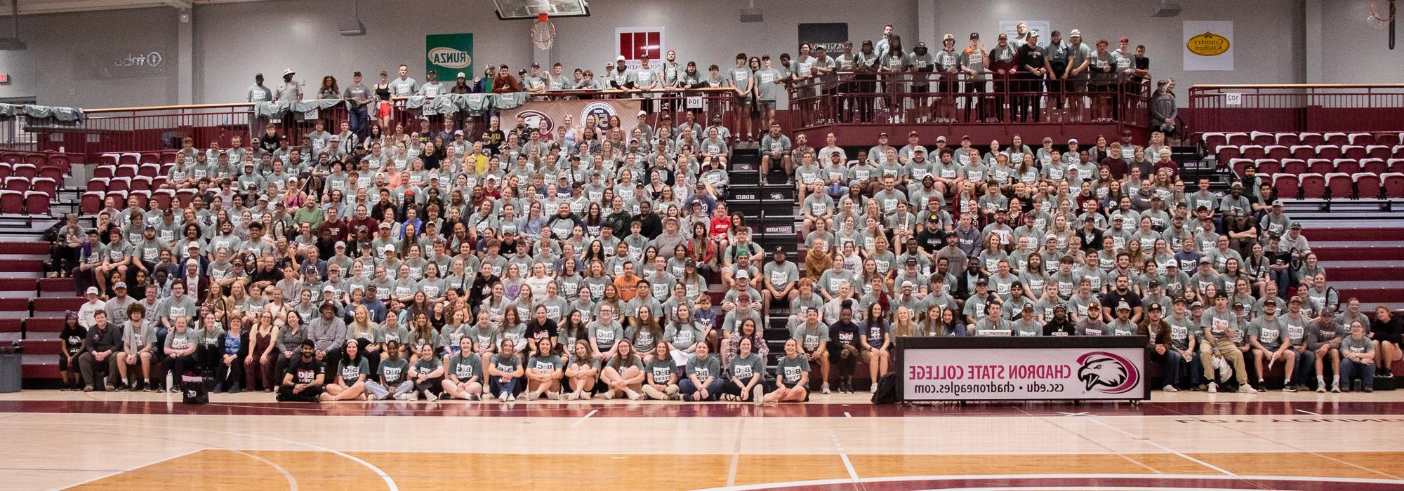 Large group seated in bleachers