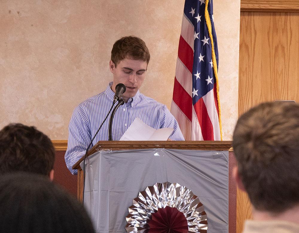 Adult male speaking at a podium